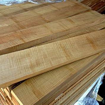Choosing the Ideal Wood for String Instrument Bridges 3 Stacked Maple Boards